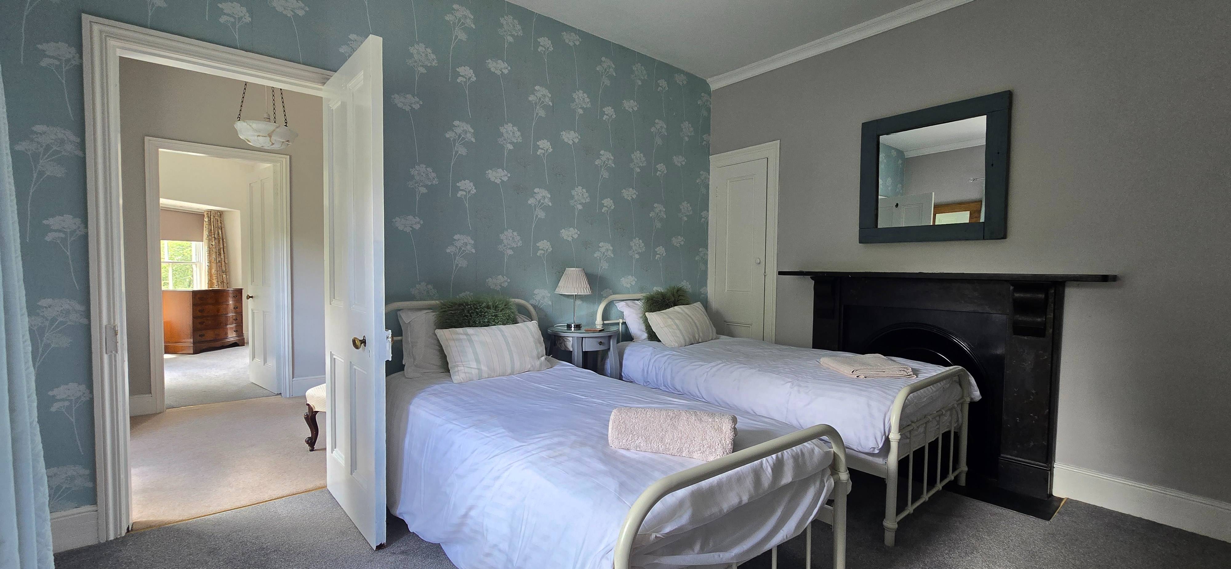 Twin bedroom, top floor, mountain-facing, blue scheme